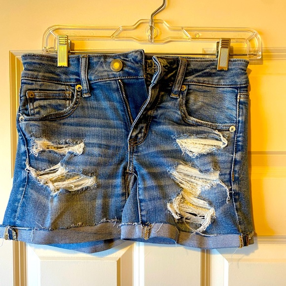 American Eagle Outfitters Pants - American Eagle AEO stretch distressed denim shorts with lace pockets size 4..